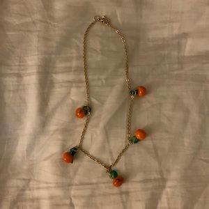 Gold necklace with glass oranges (fruit detail)